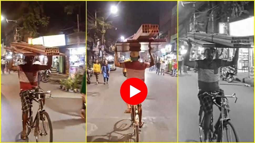 Cycle Stunt ka video: Carrying a heavy weight on his head, uncle rode a bicycle leaving his hand in the middle of the market, IPS officers also became fans